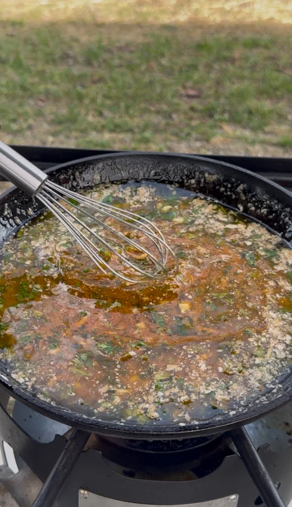 A pan of bubbling hot butter infused with garlic