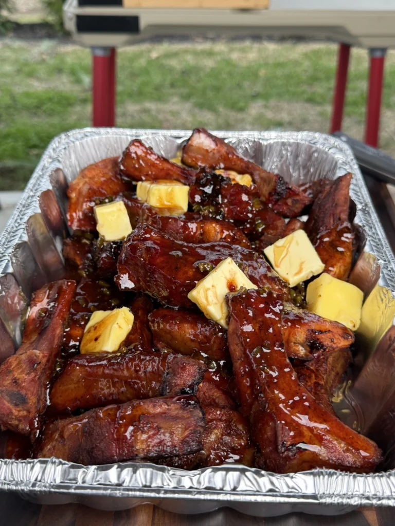 perfect party ribs in a pan with butter