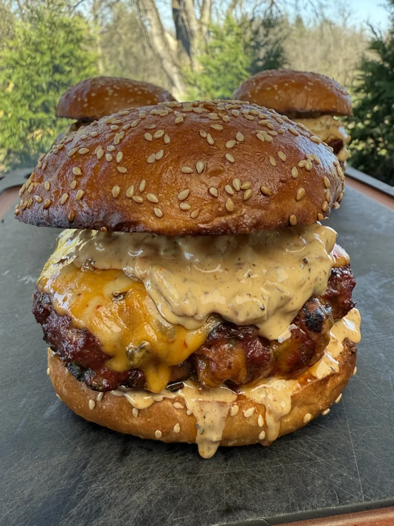Smoked cheddar jalapeño burger on a toasted brioche bun