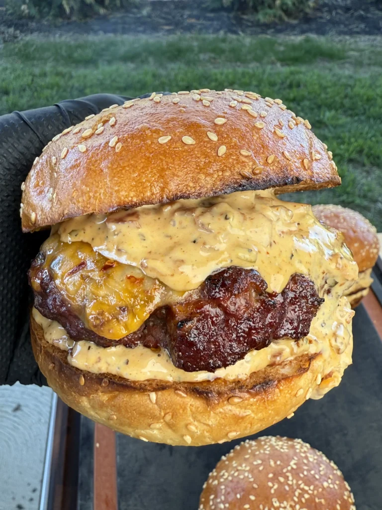 Toasted brioche bun with burger sauce and smoked beef patty