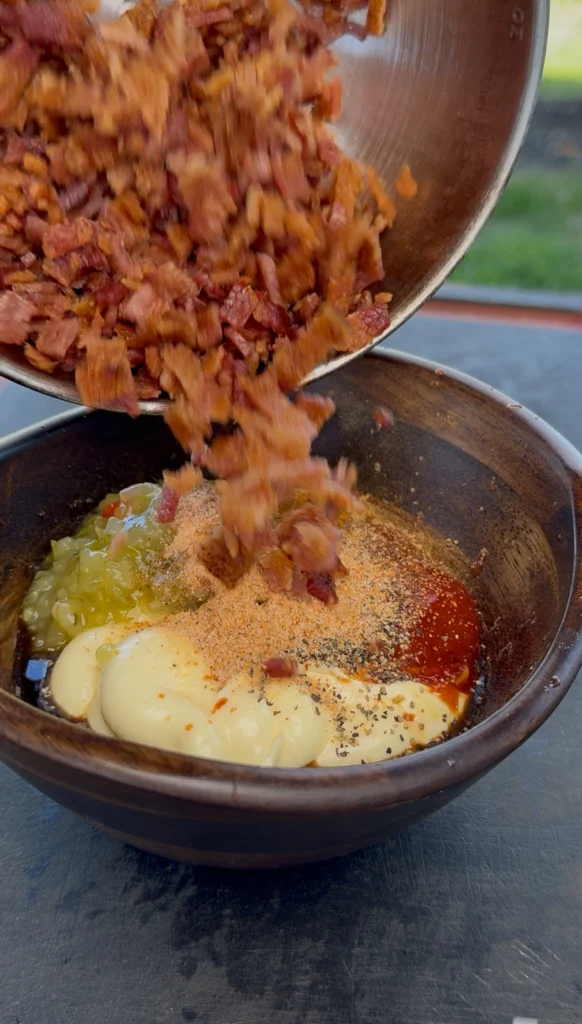 Bowl of creamy bacon burger sauce being prepped