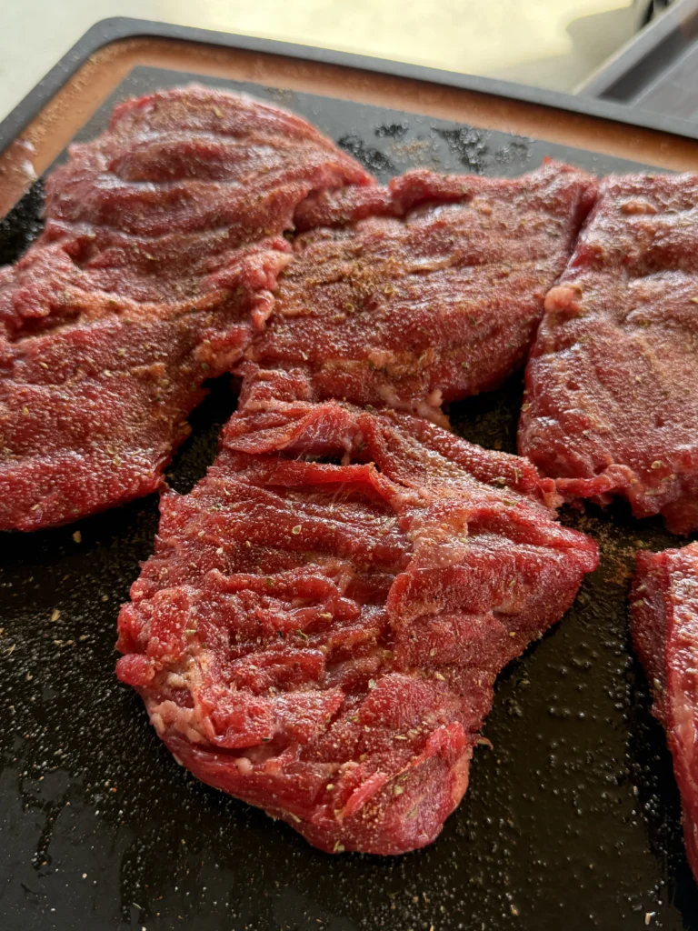 prepped skirt steak on a cutting board