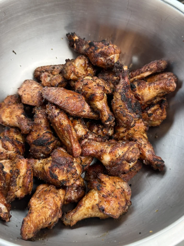 perfectly crispy chicken wings in a bowl