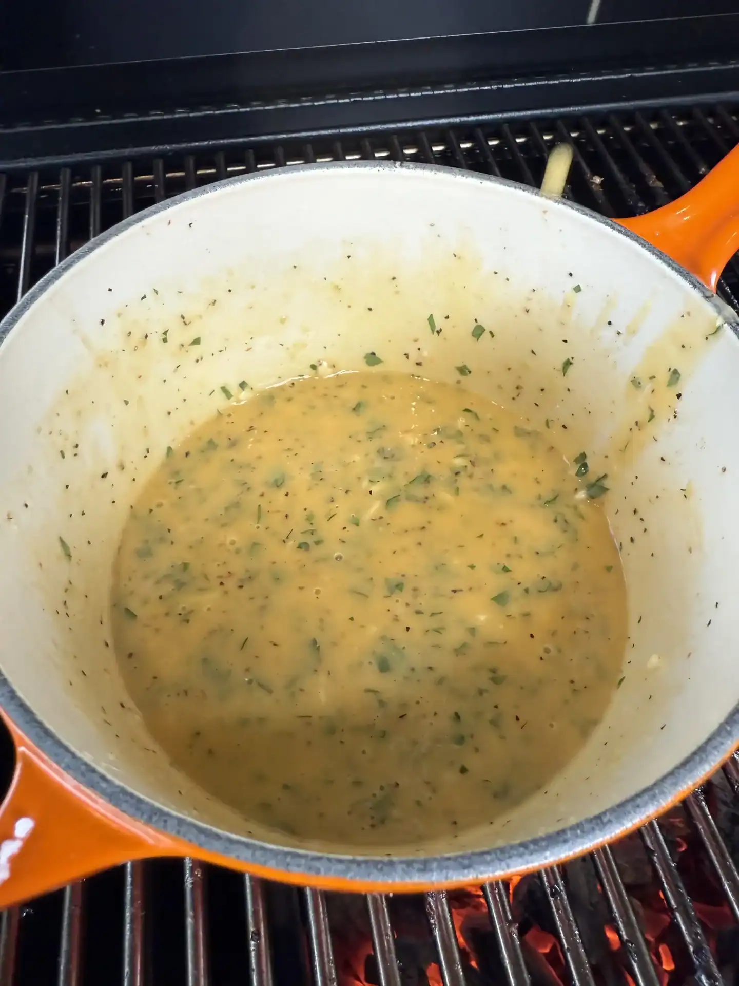 garlic lemon pepper butter sauce for chicken wings in a saucepan.