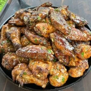 Smoked garlic lemon pepper chicken wings tossed in garlic lemon pepper butter