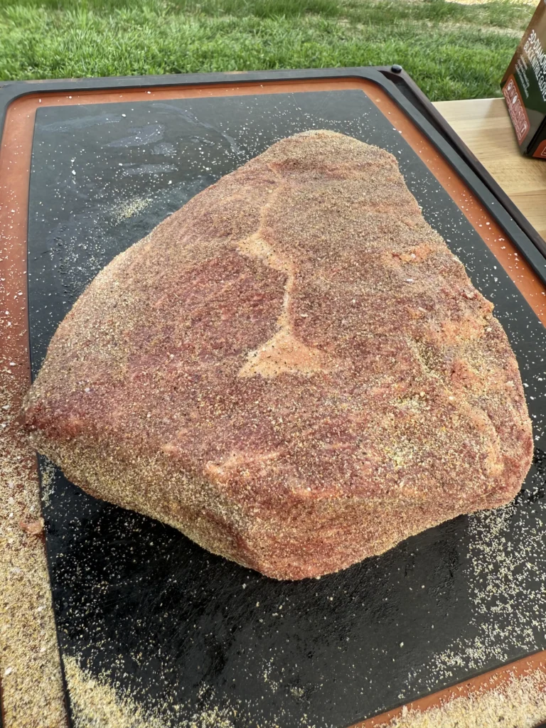 Seasoning Picanha steak with spices before grilling