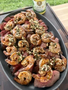 Steak and shrimp plated side-by-side