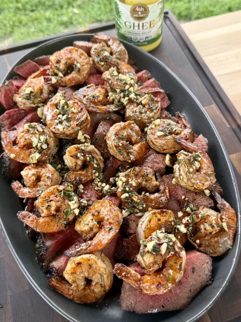 Steak and shrimp plated side-by-side