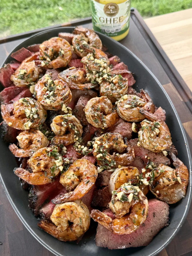 Steak and shrimp plated side-by-side