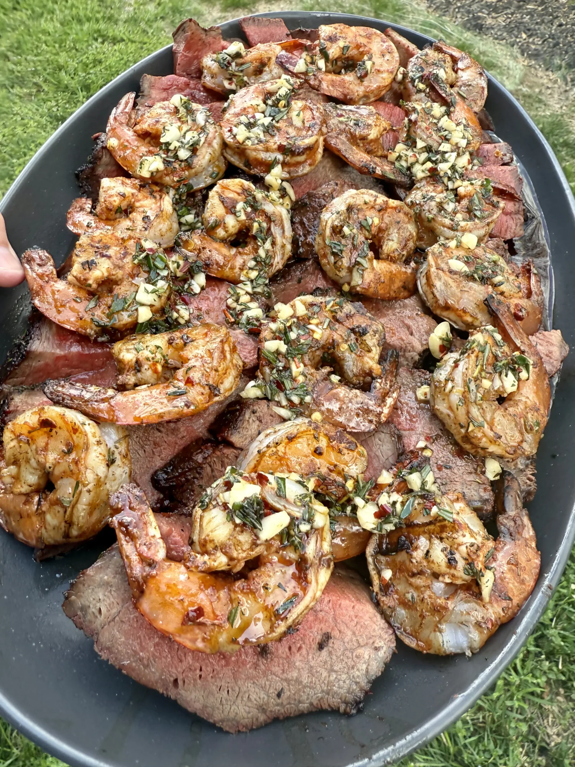 Surf and turf plated with garlic butter on top