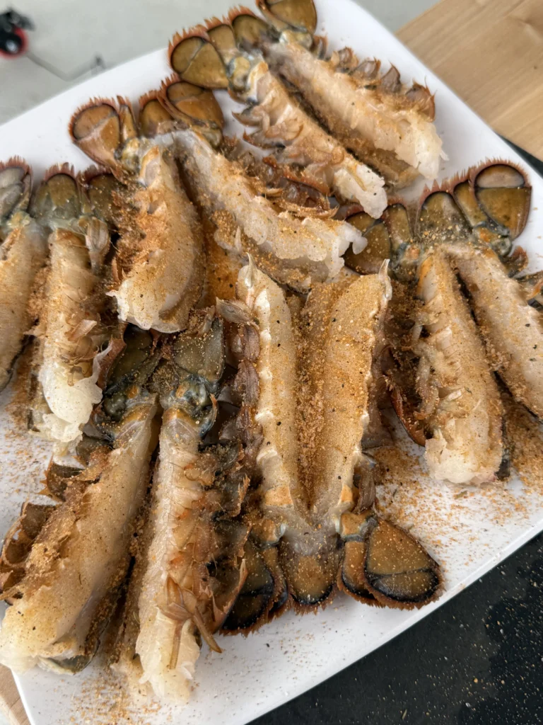 seasoned lobster tails on a plate