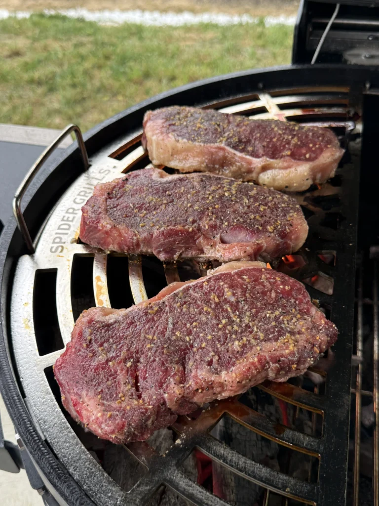 steaks being seared on the grill