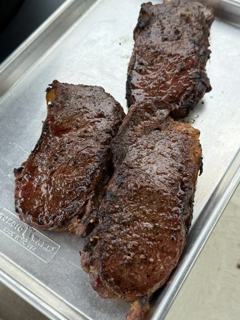 steak in a metal pan after cooking