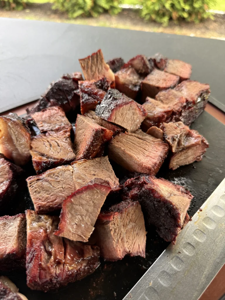 cubed chuck roast on a cutting board