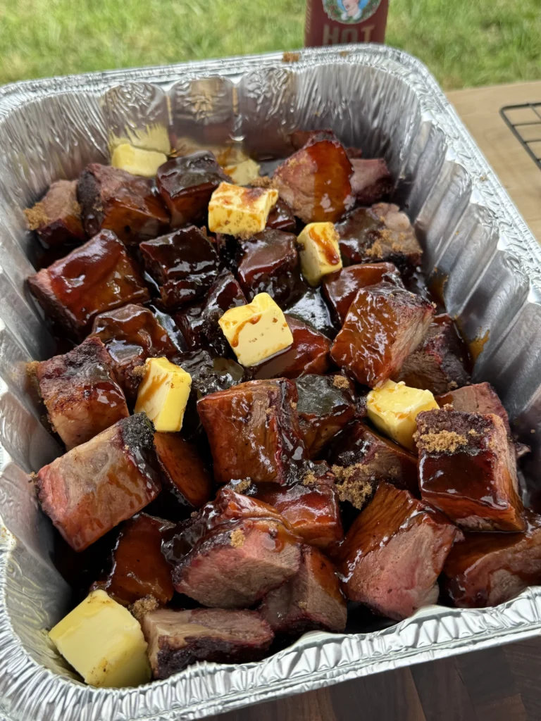 sauce and butter on the burnt ends 