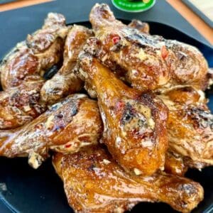 Grilled butterflied chicken drumsticks with Bang Bang suace