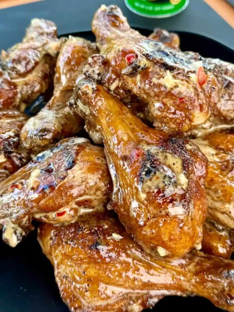 Grilled butterflied chicken drumsticks with Bang Bang suace