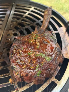 Whole tomahawk steak with caramelized crust and long bone presentation