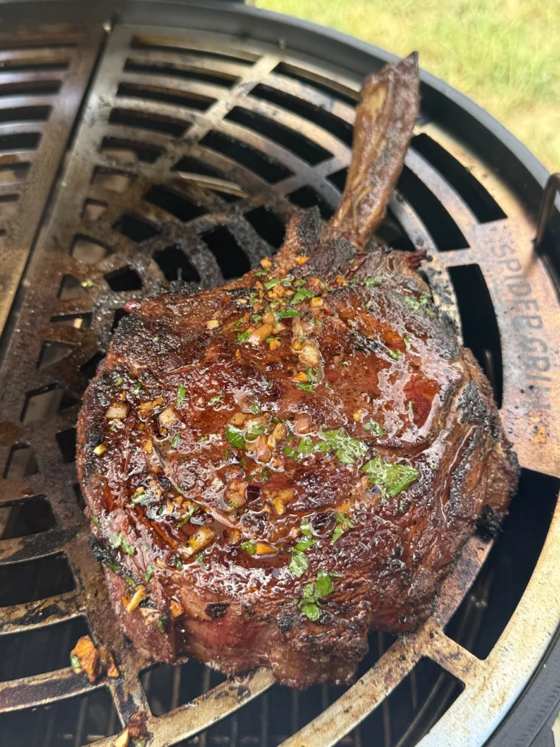 Whole tomahawk steak with caramelized crust and long bone presentation