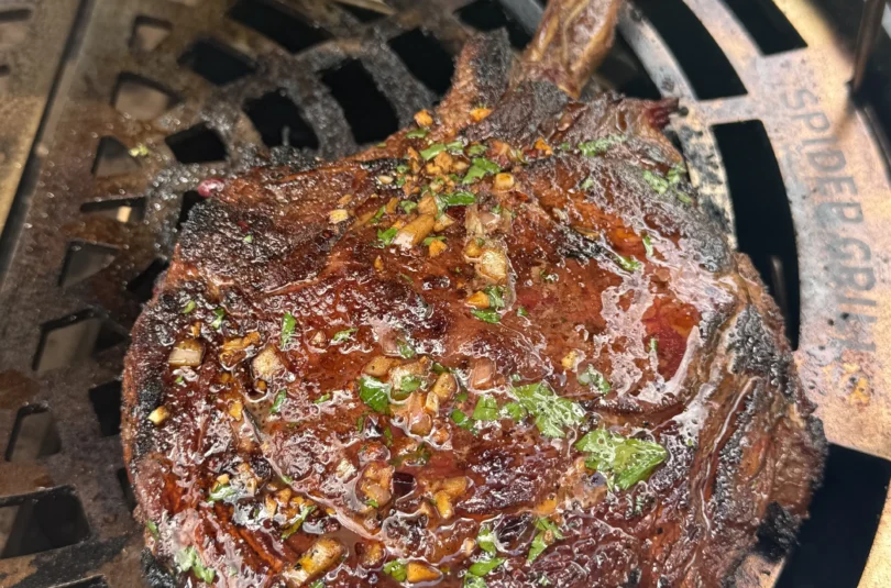 Whole tomahawk steak with caramelized crust and long bone presentation