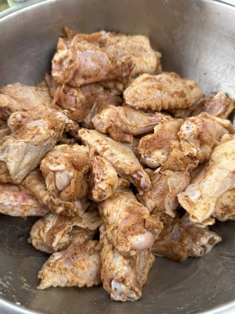 chicken wings with seasoning on them