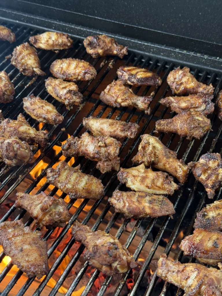 perfectly cooked chicken wings on the grill 