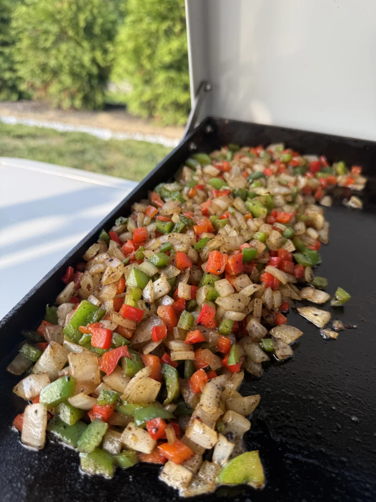 chopped vegetables on a griddle