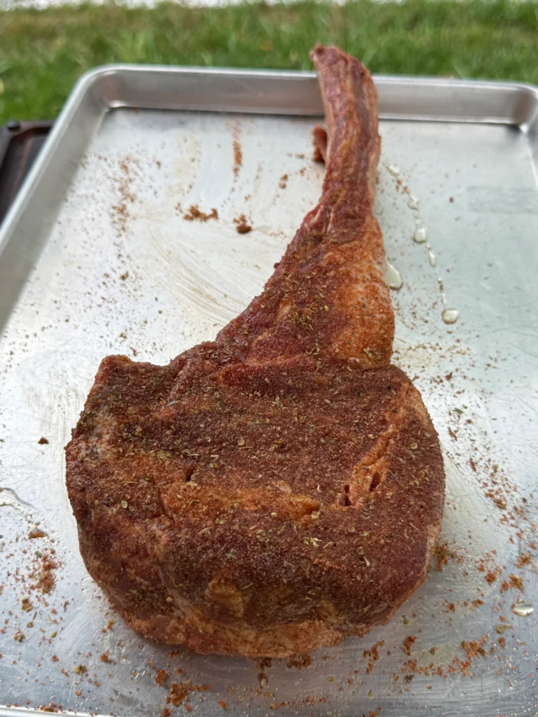 seasoned ribeye on a tray