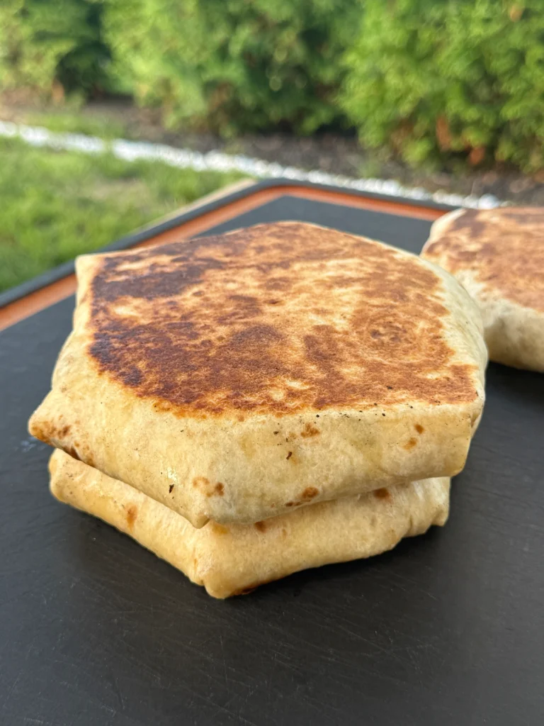 assembling the crunchwraps on a cutting board