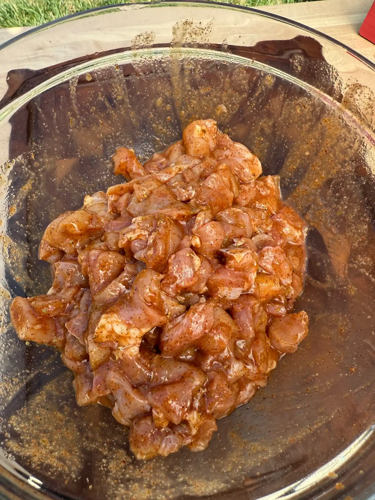 chicken in a bowl with seasoning