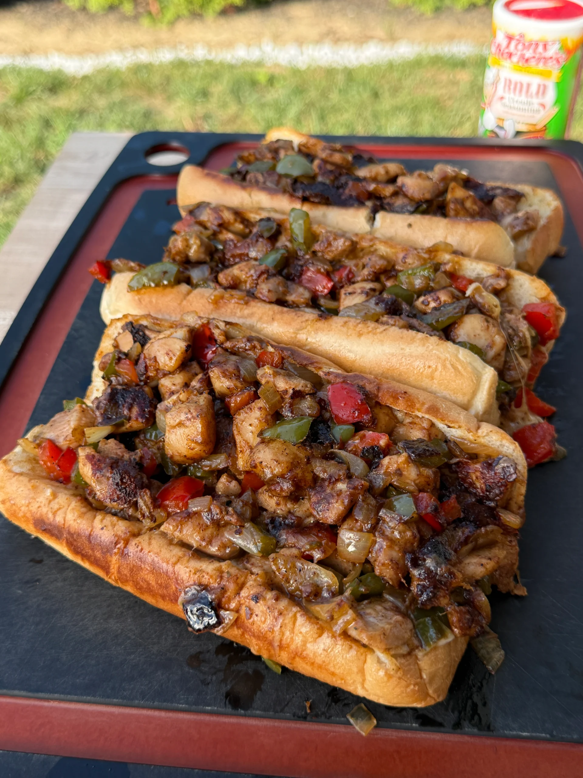 3 chicken cheesesteaks on a cutting board