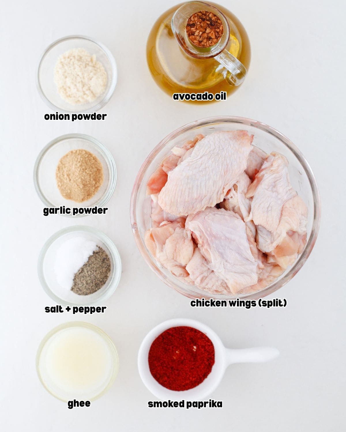 ingredients for chili lime chicken wings recipe placed in bowls on a kitchen countertop.