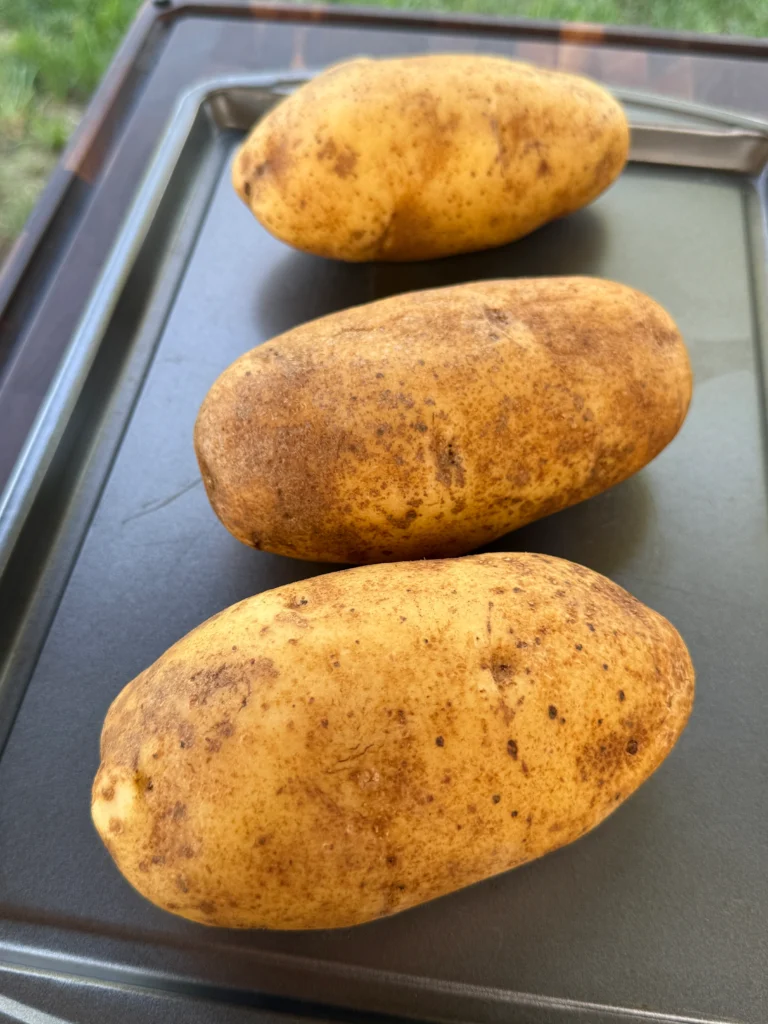 unseasoned potato on a pan