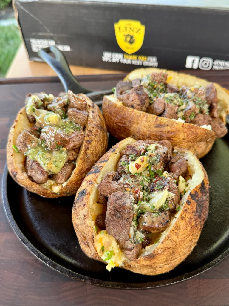 garnished and served loaded baked potatoes with steak bites
