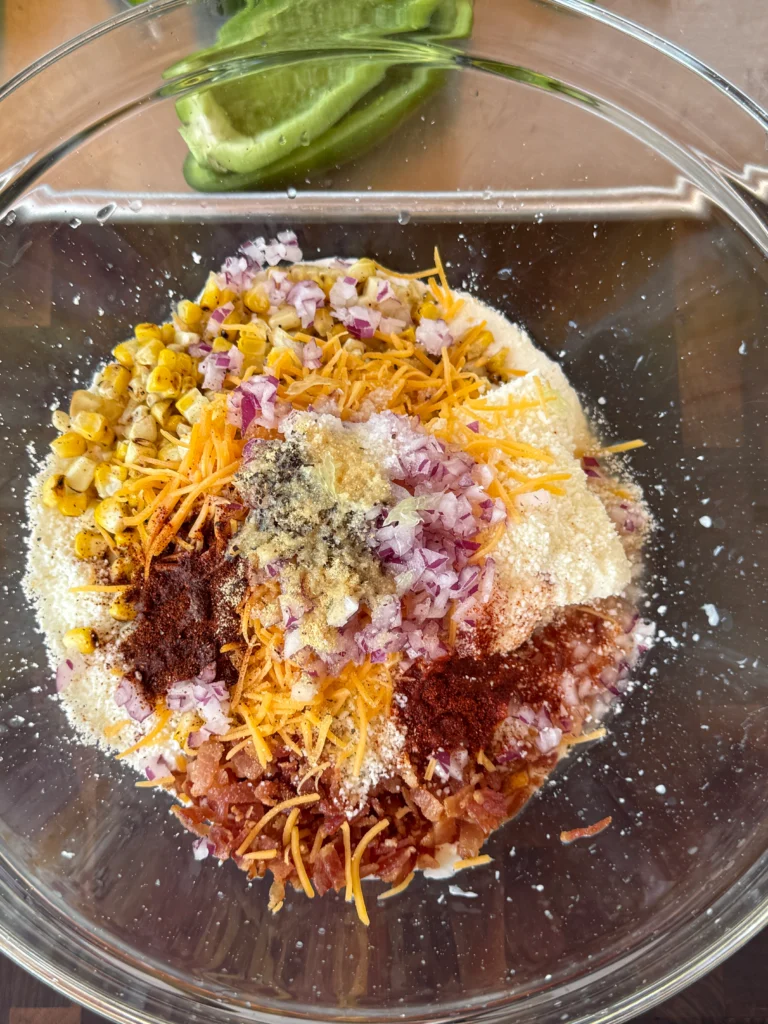 ingredients for the elote poppers in a bowl