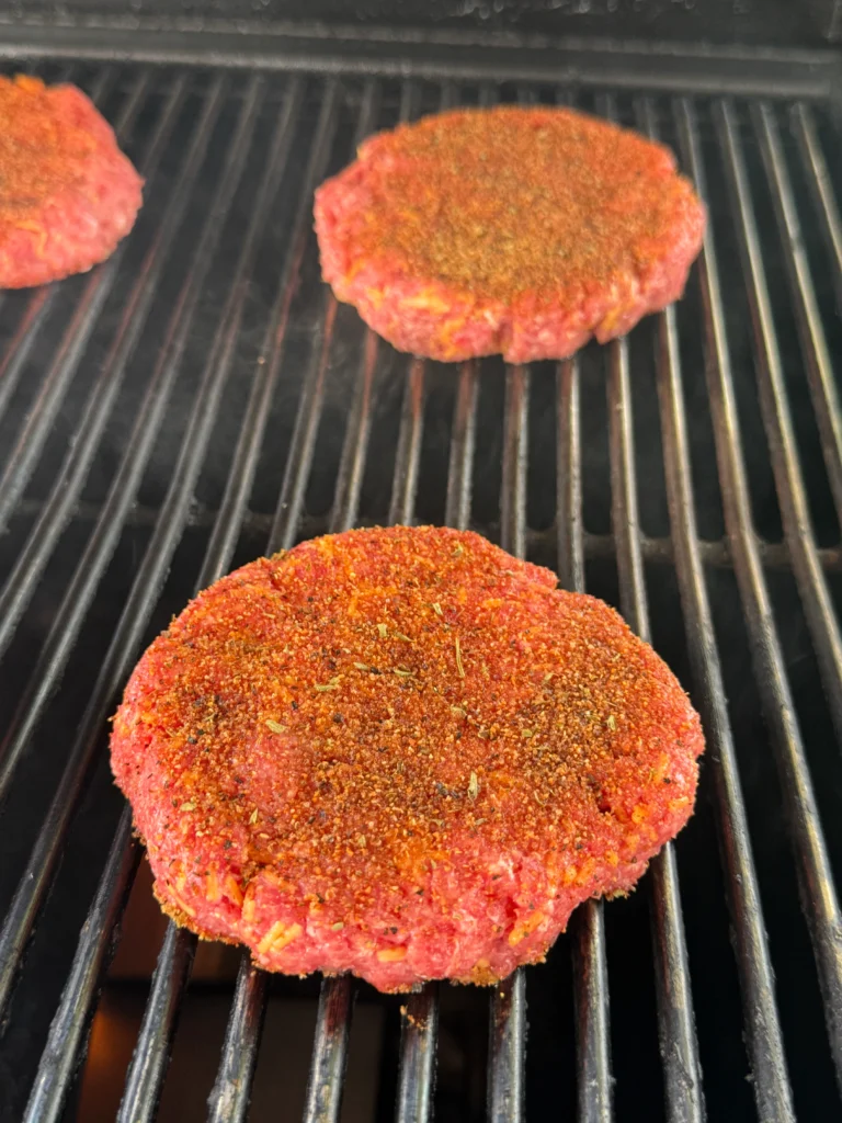 smoking the burgers on a hasty bake