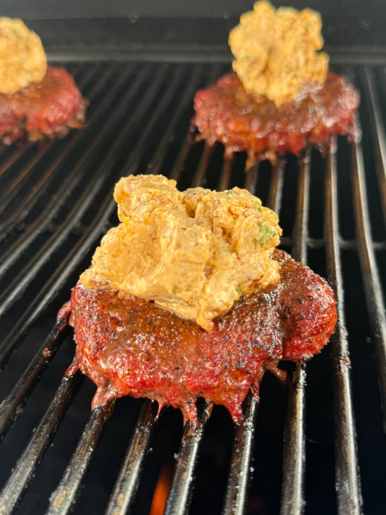 smoked burgers with a scoop of stuffing on the top