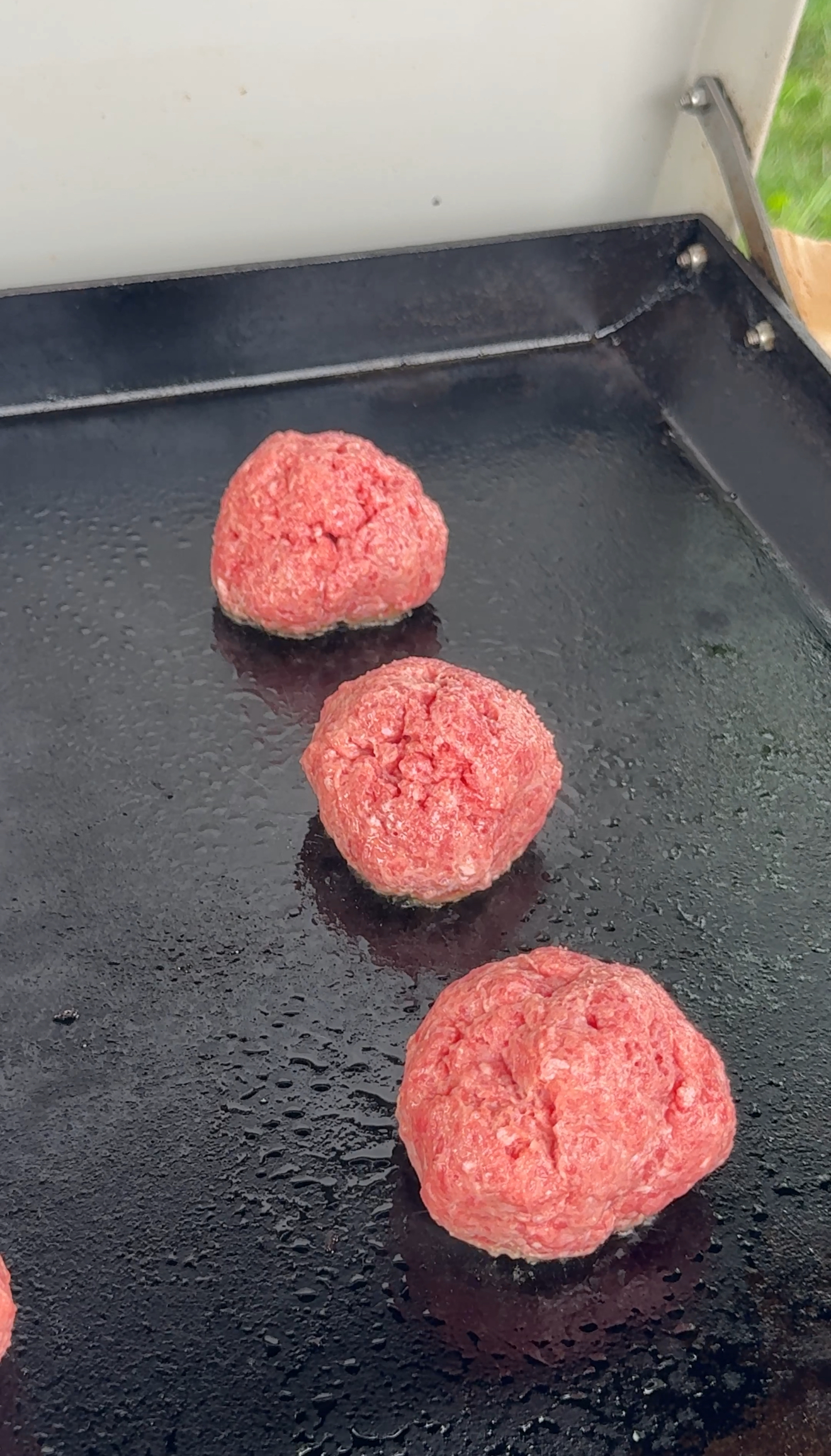 burgers on the griddle to be smashed