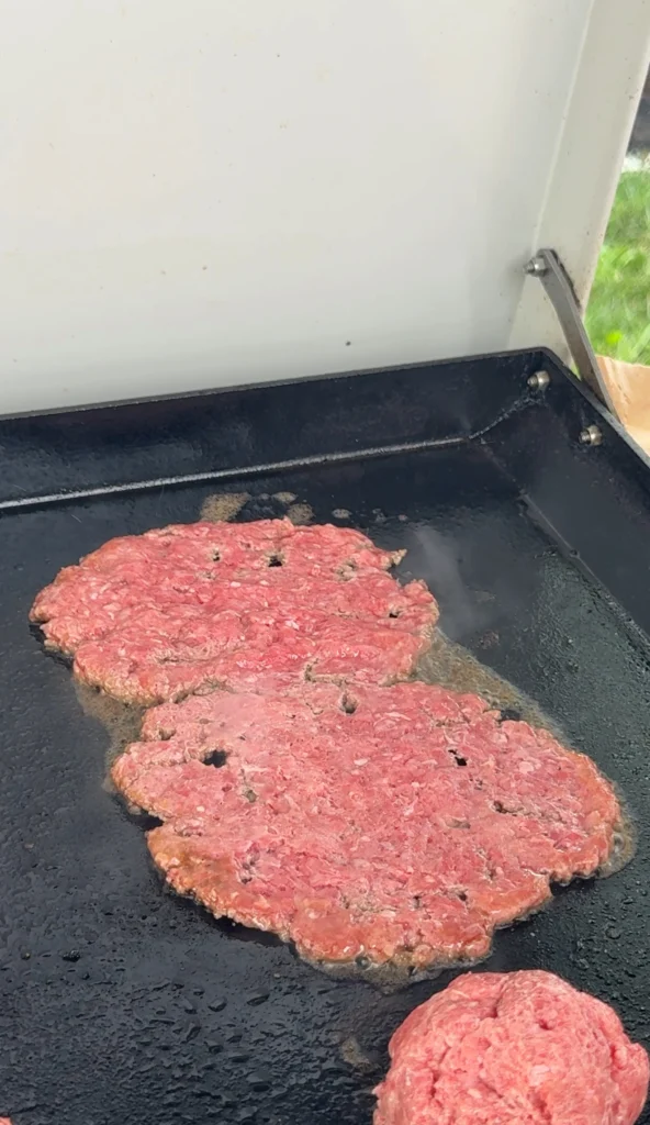 smash burgers on a griddle top
