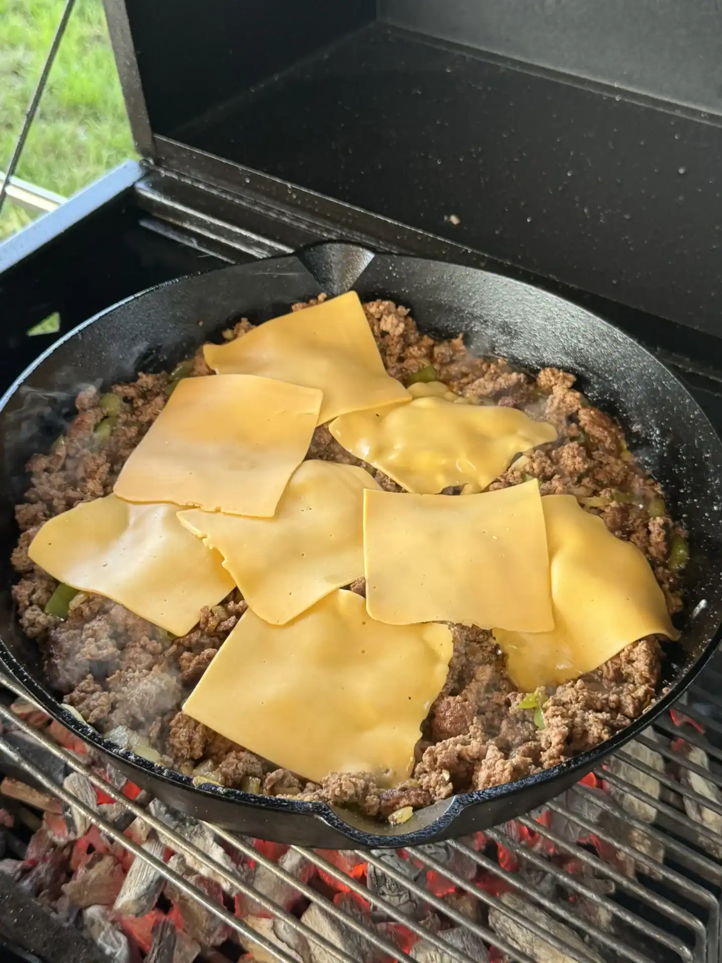 chopped cheese in a cast iron skillet