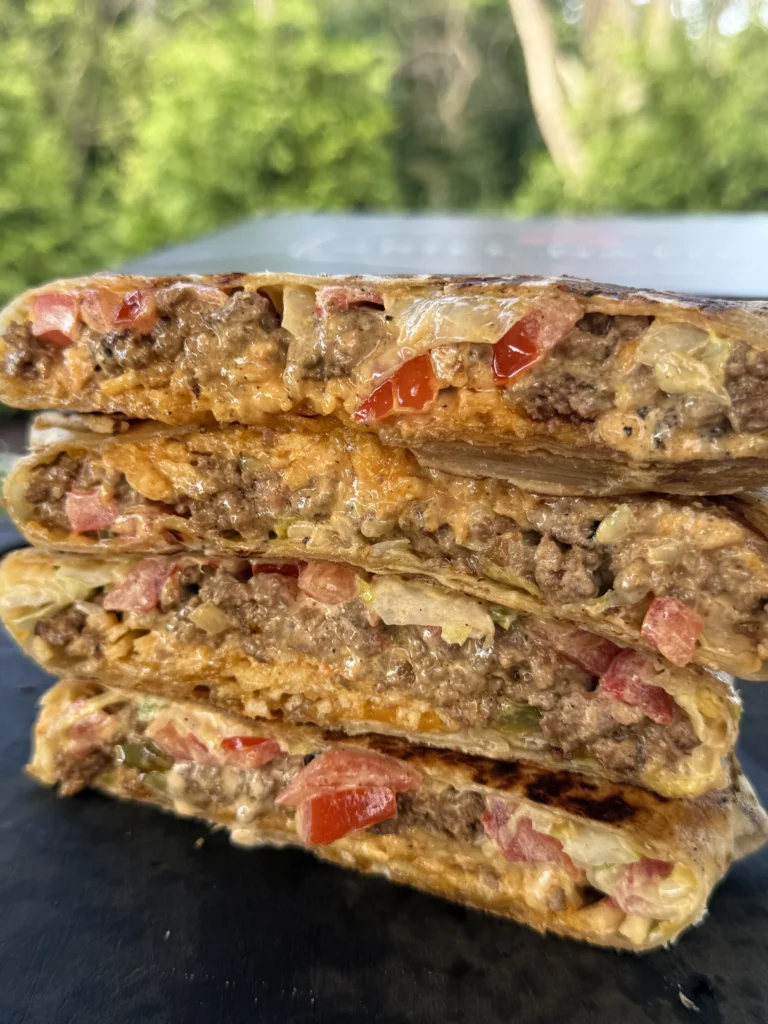 stacked crunch wraps on a cutting board