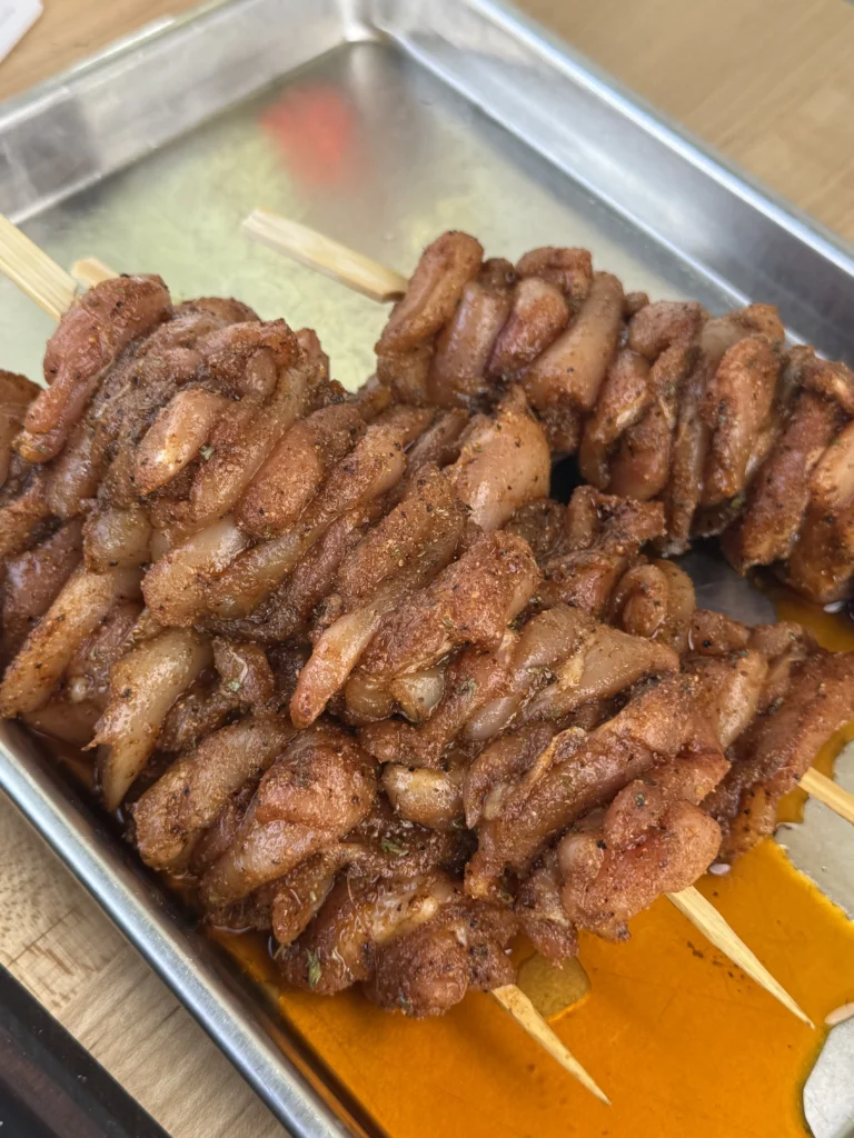 chicken on the wooden skewers with the honey garlic sauce