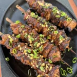 chicken skewers on a plate
