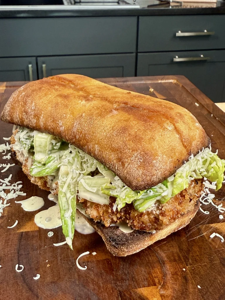 assembled chicken caesar salad sandwich