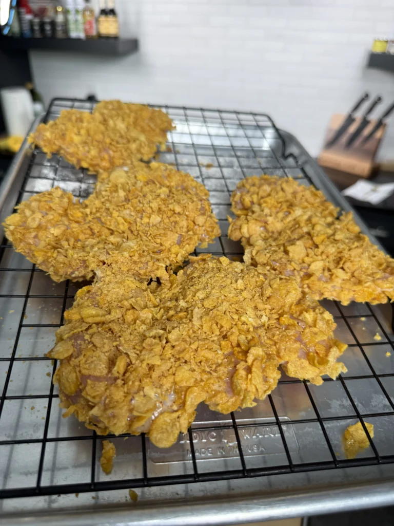 breaded chicken on a resting rack