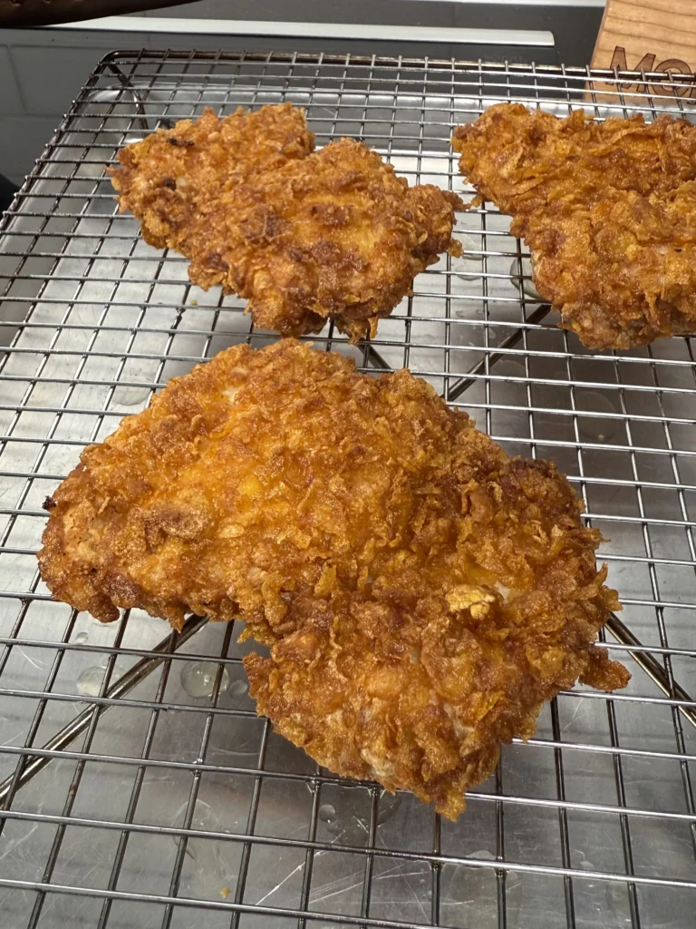 double frying the chicken for the spicy chicken sandwiches