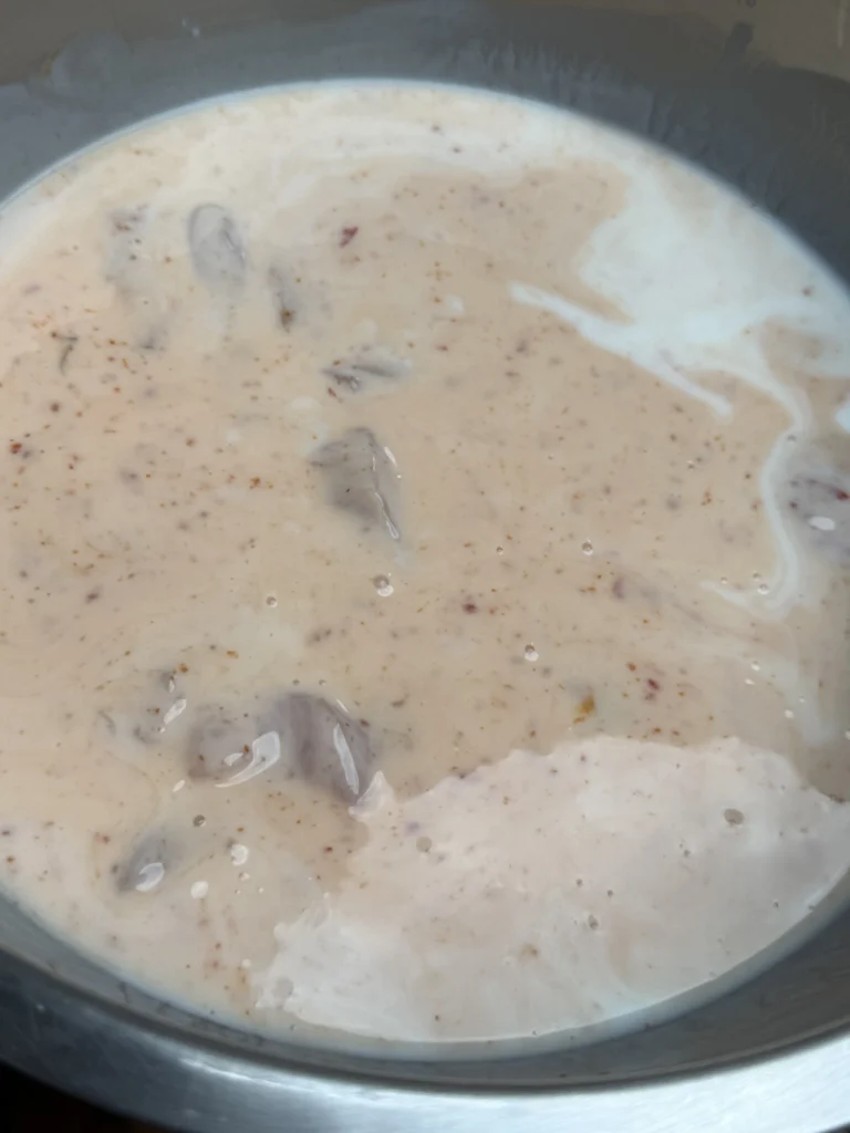 marinating chicken in a bowl
