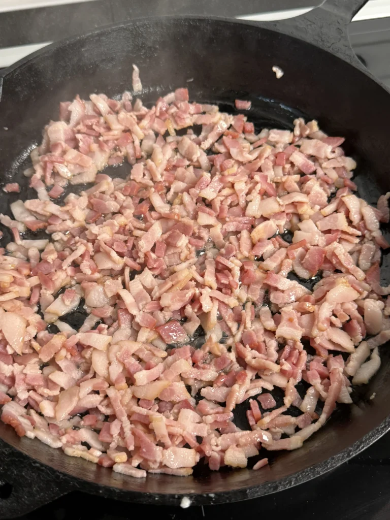 cooked bacon in a cast iron