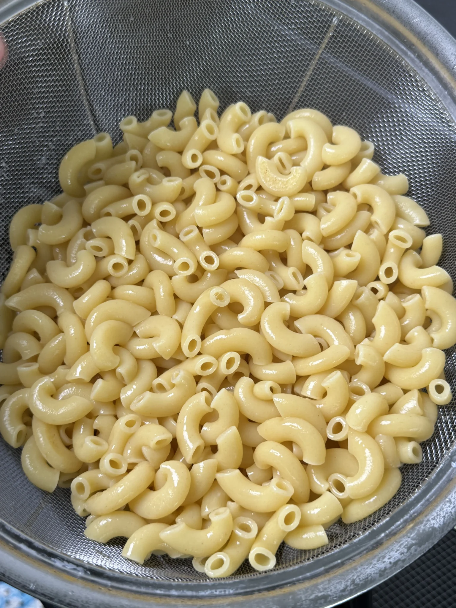 al dente pasta in the a strainer