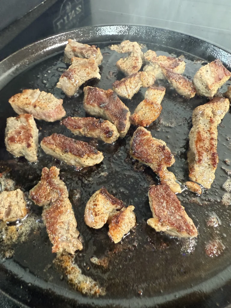 seared steak bites on the cast iron